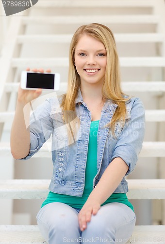 Image of smiling student with smartphone blank screen