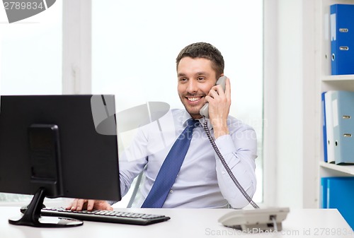 Image of smiling businessman or student with computer