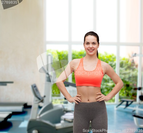 Image of smiling teenage girl in sportswear