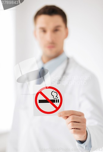 Image of male doctor holding no smoking sign