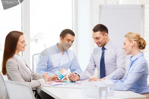 Image of happy team of architects and designers in office