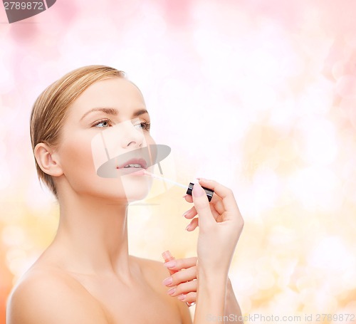 Image of beautiful woman with lipgloss