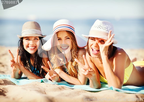 Image of girls sunbathing on the beach