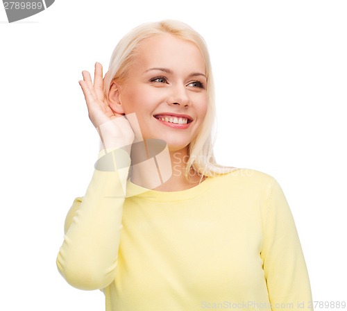 Image of smiling young woman listening to gossip