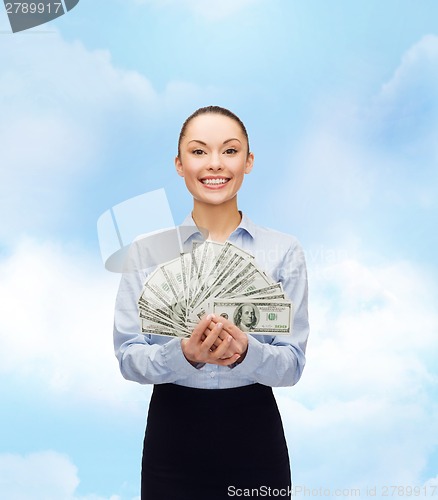 Image of young businesswoman with dollar cash money