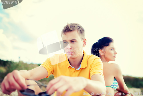 Image of stressed couple outside