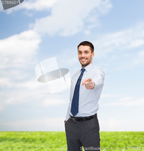 Image of handsome businessman pointing finger at you