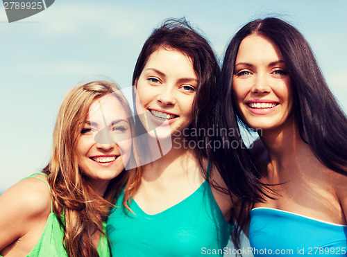 Image of girls walking on the beach