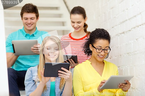 Image of smiling students with tablet pc computer