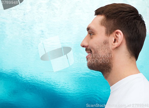 Image of portrait of smiling young handsome man