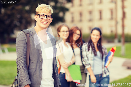 Image of teenage boy with classmates on the back