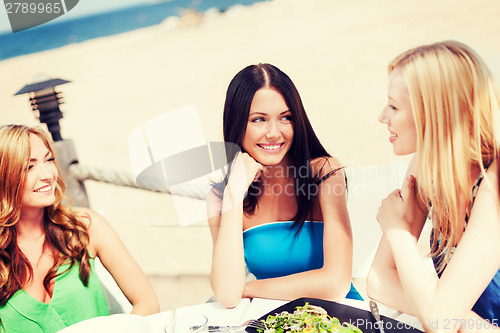 Image of girls in cafe on the beach