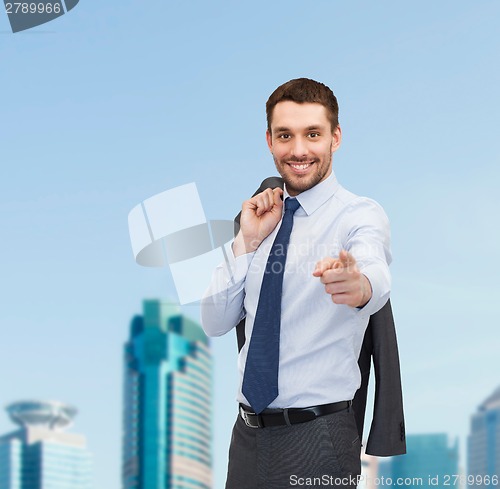 Image of handsome buisnessman with jacket over shoulder