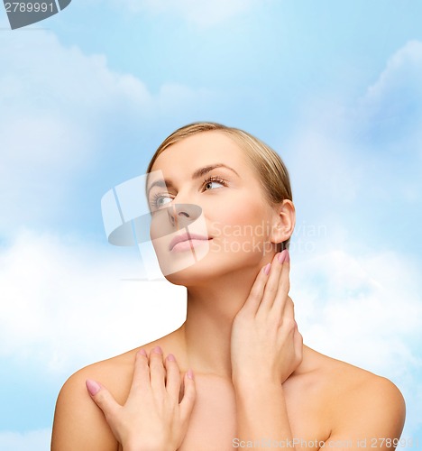 Image of face and hands of beautiful woman