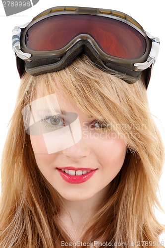 Image of smiling teenage girl in snowboard goggles