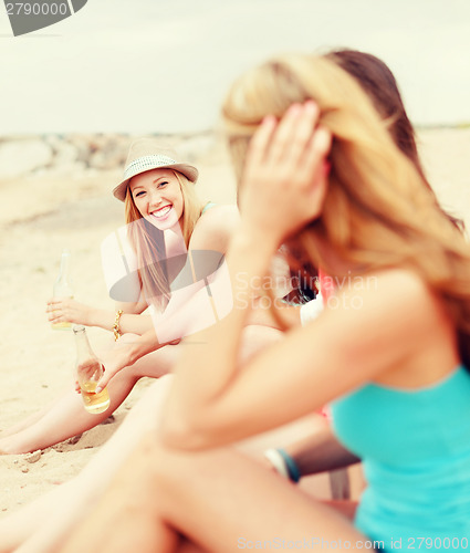 Image of girls with drinks on the beach