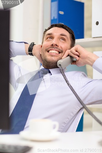 Image of smiling businessman or student with computer