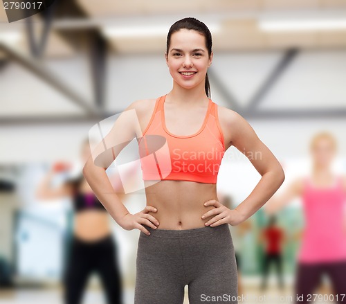 Image of smiling teenage girl in sportswear