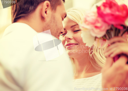 Image of couple with flowers in the city
