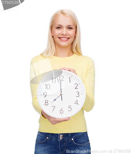 Image of student with wall clock