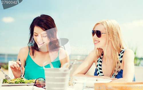 Image of girls in cafe on the beach