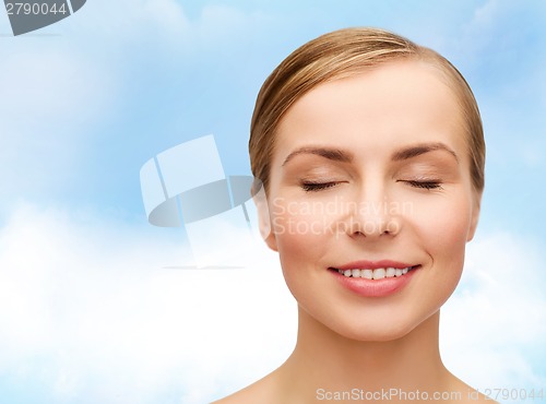 Image of face of beautiful woman with closed eyes