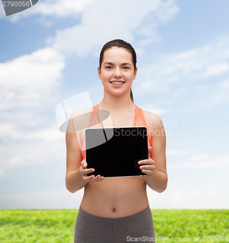 Image of sporty woman with tablet pc blank screen
