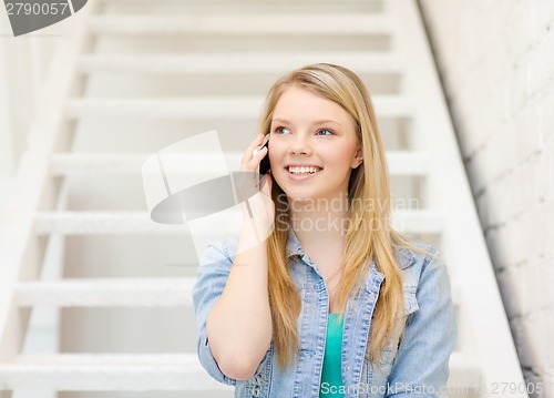 Image of smiling female student with smartphone