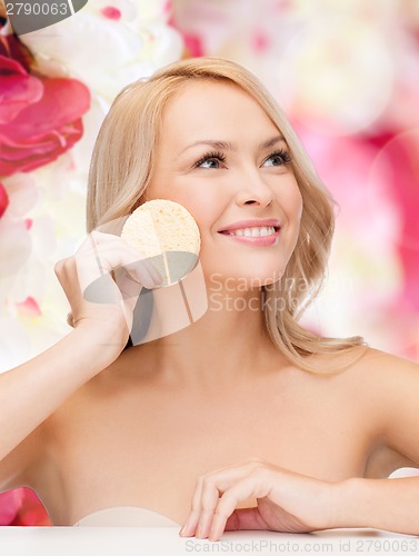 Image of beautiful woman with sponge