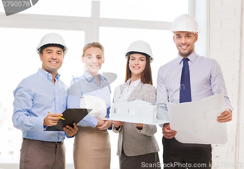Image of happy business team in office