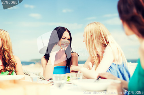 Image of girls in cafe on the beach