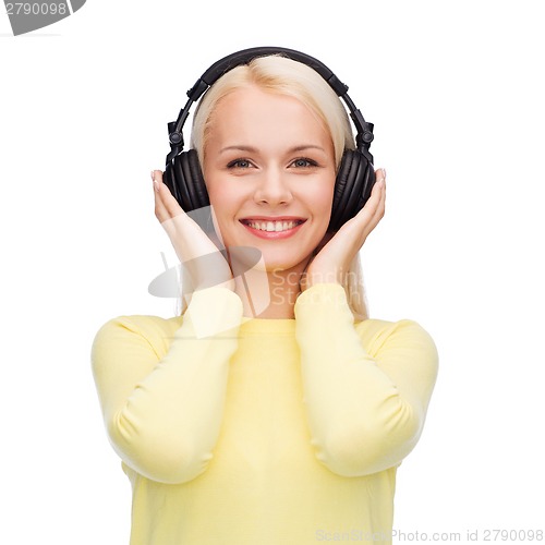 Image of smiling young woman with headphones