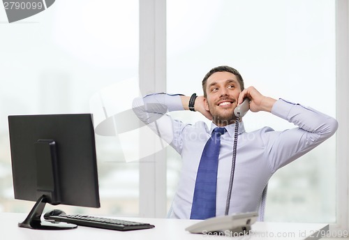 Image of smiling businessman or student with computer