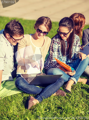 Image of students or teenagers with laptop computers