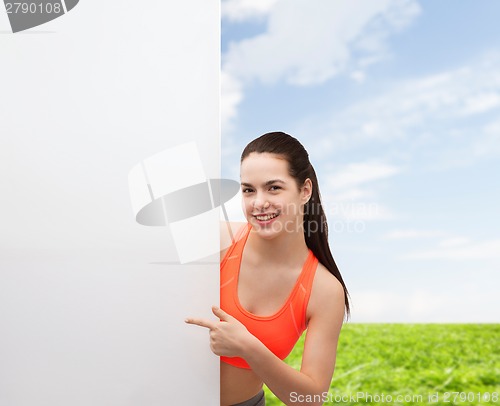 Image of teenage girl in sportswear with white board