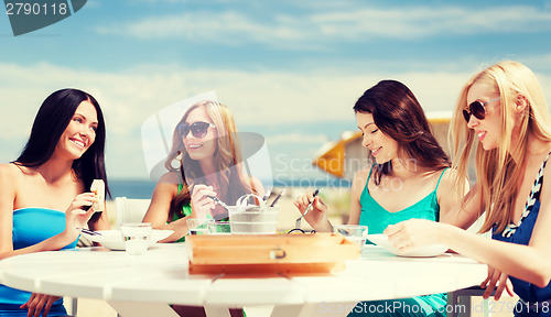 Image of girls in cafe on the beach