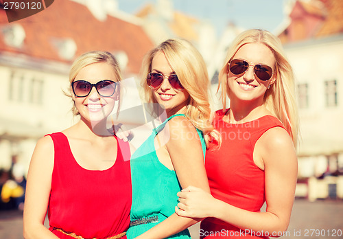 Image of three beautiful women in the city