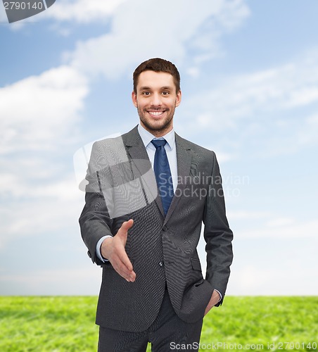 Image of businessman with open hand ready for handshake