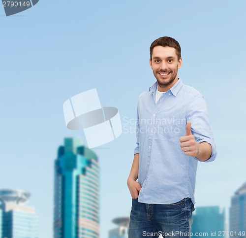 Image of smiling man showing thumbs up