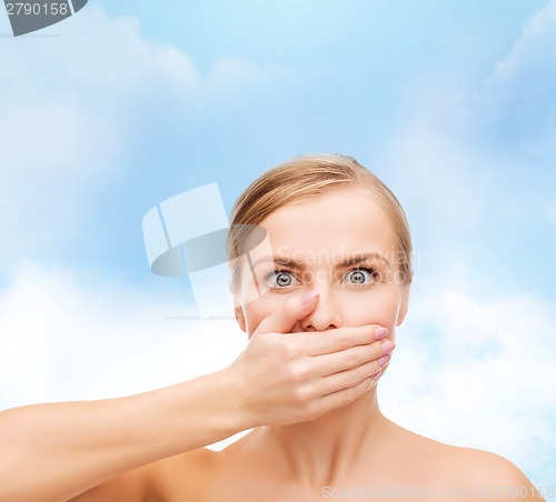 Image of young woman doing hush gesrute