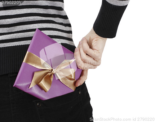 Image of Young woman holding a present