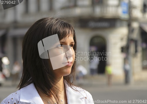 Image of Young woman in a city