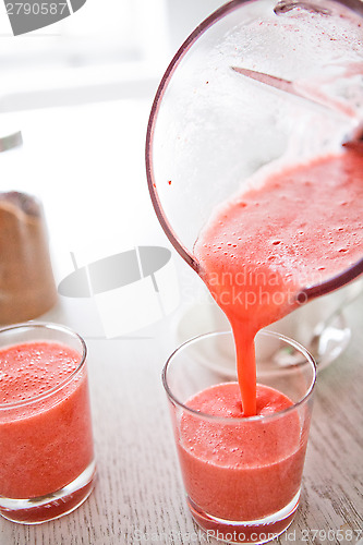 Image of Pouring a delicious strawberry smoothie