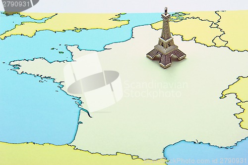 Image of Eiffel Tower miniature on map