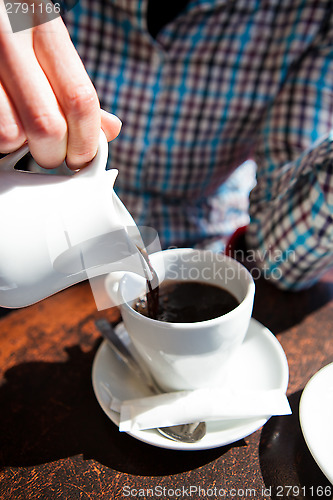 Image of Pouring black filter coffee