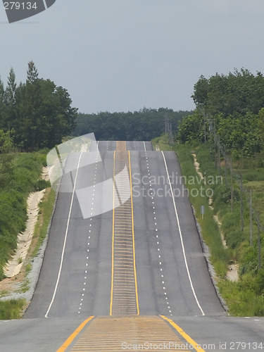 Image of Empty road over a hill