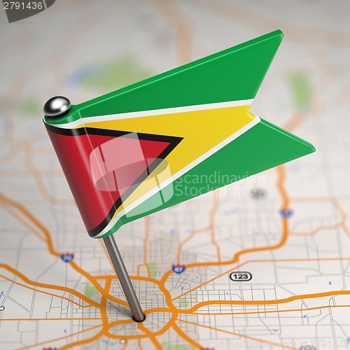 Image of Guyana Small Flag on a Map Background.