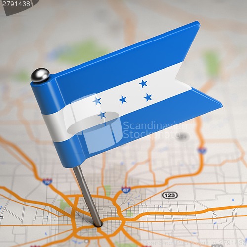 Image of Honduras Small Flag on a Map Background.