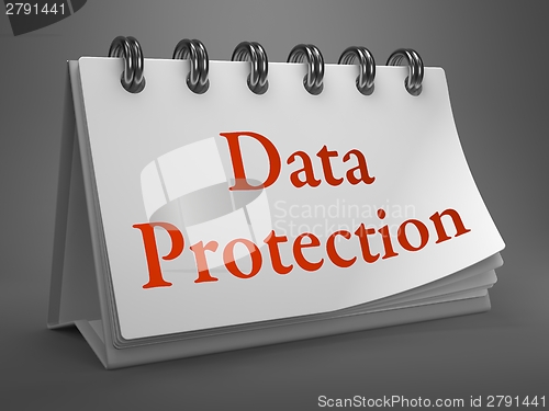 Image of Data Protection -Red Words on Desktop Calendar.