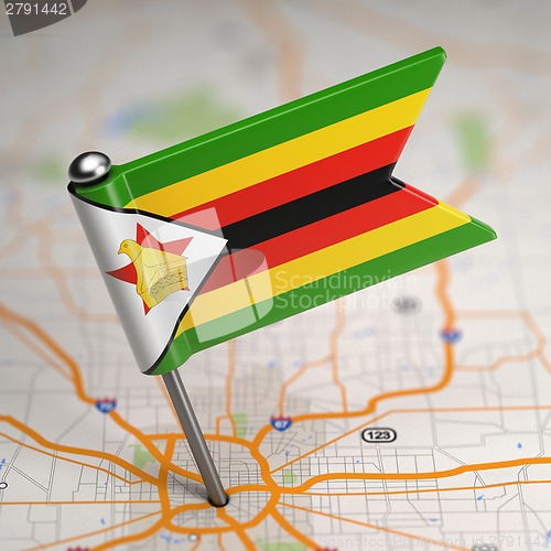 Image of Zimbabwe Small Flag on a Map Background.